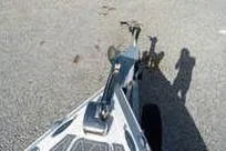 Slide: The Image of 2007 Fountain 38 Tournament Edition boat on trailer, shadow on pavement. - 21