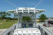 Slide: The Image of 2007 Fountain 38 Tournament Edition boat with center console and electronics, set against a clear sky. - 22