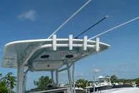Slide: The Image of 2007 Fountain 38 Tournament Edition boat with fishing rod holders under clear blue sky. - 23