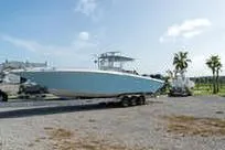 Slide: The Image of 2007 Fountain 38 Tournament Edition boat on trailer, parked outdoors under clear sky. - 3