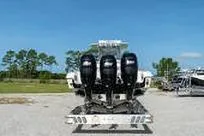 Slide: The Image of 2007 Fountain 38 Tournament Edition boat with triple outboard engines on a trailer. - 6