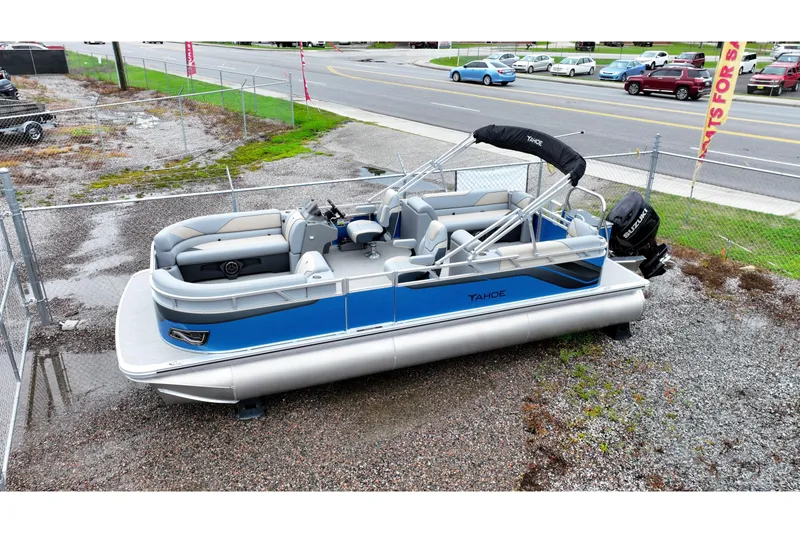 The Image of 2026 Tahoe Pontoon Sport 85 Quad Lounger, blue and silver, parked on gravel lot. - 0