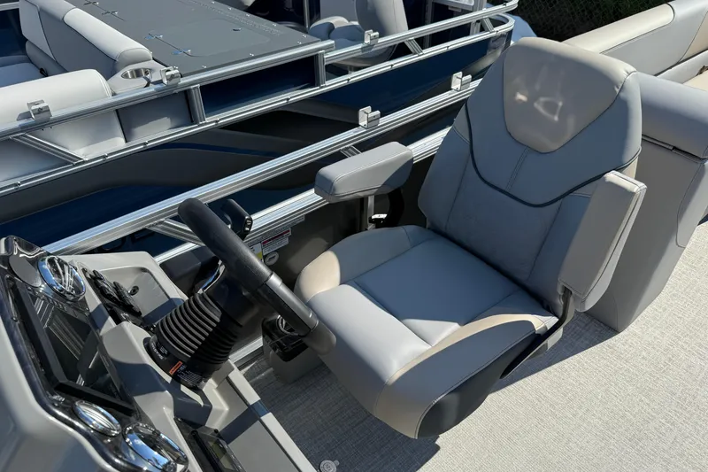 Slide: The Image of 2026 Tahoe Pontoon Sport 85 Quad Lounger captain's chair and helm, showcasing luxury design. - 11