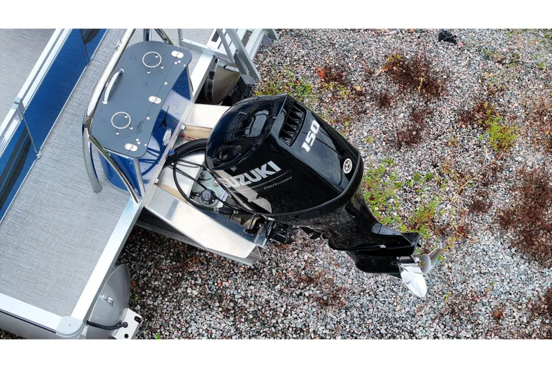 Slide: The Image of 2026 Tahoe Pontoon Sport 85 Quad Lounger with Suzuki 150 outboard motor, aerial view. - 3
