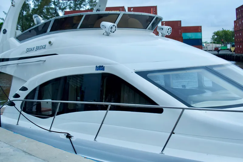 The Image of 2006 Sea Ray 44 Sedan Bridge yacht docked, showcasing sleek design and modern features. - 0