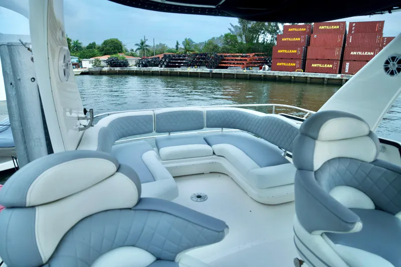 Slide: The Image of Luxurious 2006 Sea Ray 44 Sedan Bridge yacht interior with plush seating by the water. - 11