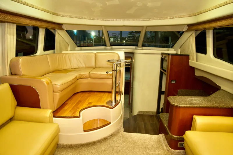 Slide: The Image of Luxurious interior of a 2006 Sea Ray 44 Sedan Bridge yacht with elegant seating and modern amenities. - 14