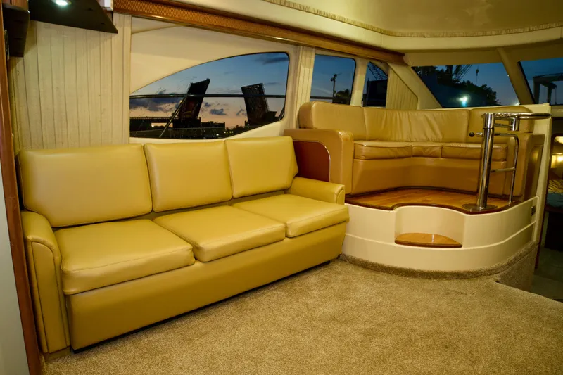 Slide: The Image of Luxurious interior of 2006 Sea Ray 44 Sedan Bridge yacht with beige leather seating. - 16