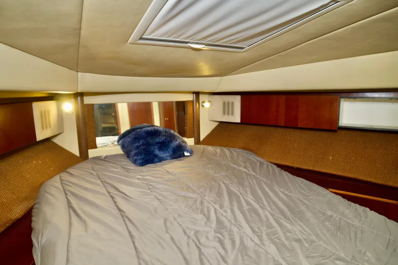 Slide: The Image of 2006 Sea Ray 44 Sedan Bridge cabin with cozy bed and plush pillow. - 20