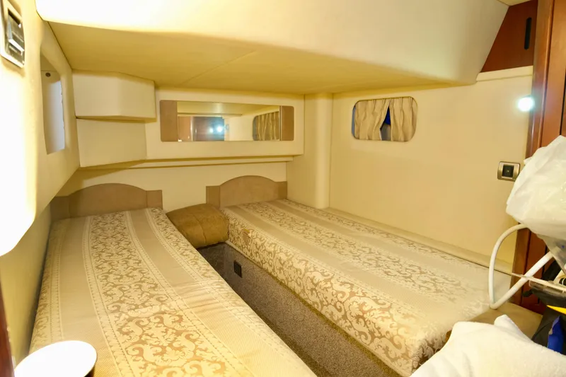 Slide: The Image of Interior cabin of 2006 Sea Ray 44 Sedan Bridge with twin beds. - 21