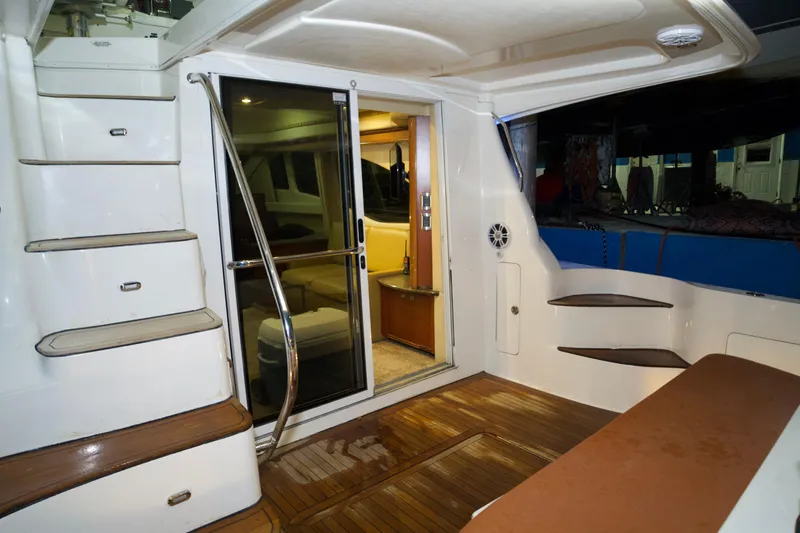 Slide: The Image of 2006 Sea Ray 44 Sedan Bridge yacht interior with wooden flooring and modern design. - 25