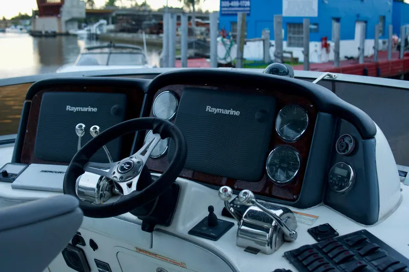 Slide: The Image of 2006 Sea Ray 44 Sedan Bridge helm with Raymarine navigation system. - 5