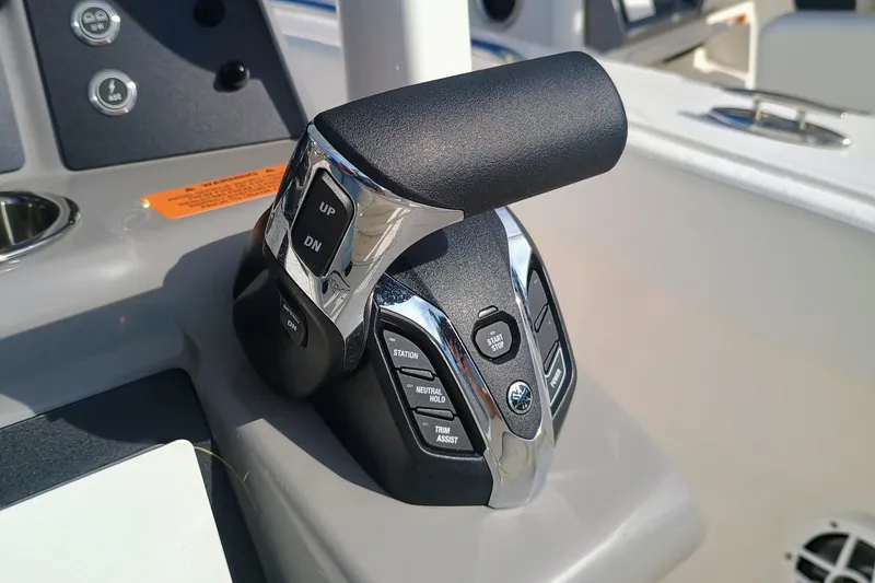 Slide: The Image of Throttle control of 2025 Robalo R230 Center Console boat, featuring modern design and functionality. - 14