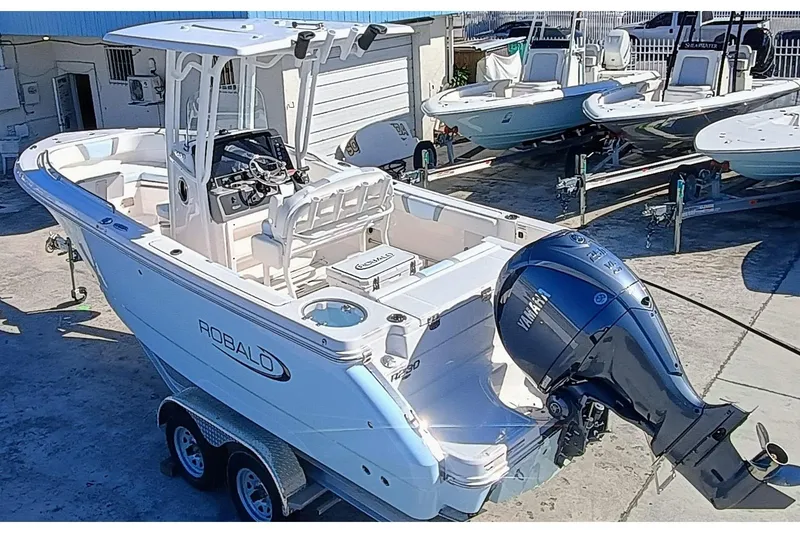Slide: The Image of 2025 Robalo R230 Center Console boat with Yamaha outboard engine on trailer. - 3