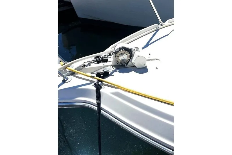 Slide: The Image of 1997 Bayliner 2855 Ciera boat deck with winch and yellow rope. - 15