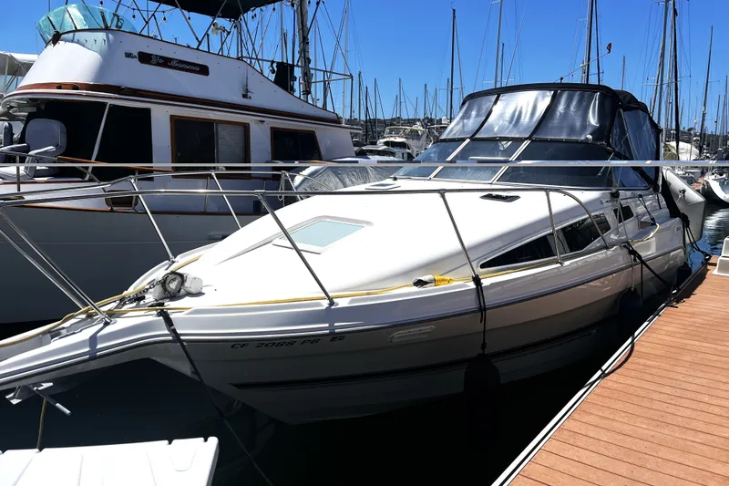 The Image of 1997 Bayliner 2855 Ciera docked at marina, featuring sleek design and spacious cabin. - 0