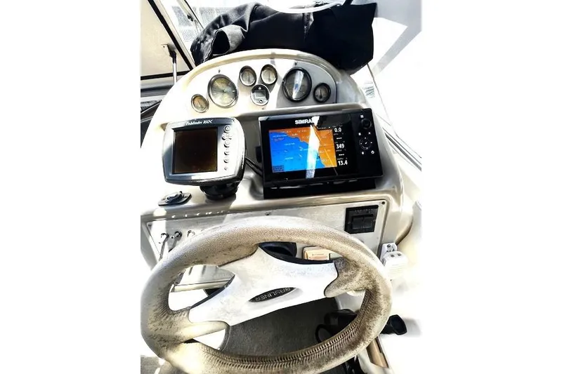 Slide: The Image of Dashboard of a 1997 Bayliner 2855 Ciera boat with navigation equipment. - 9