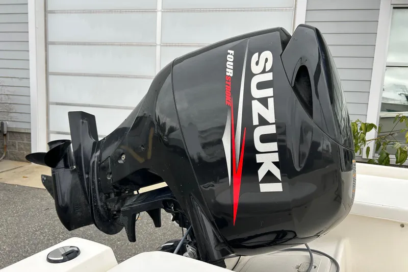 Slide: The Image of Outboard motor on 2014 Key West 1720 Center Console boat, Suzuki four-stroke engine. - 10