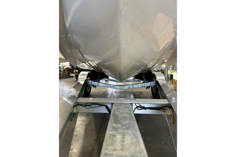 Slide: The Image of 2014 Key West 1720 Center Console boat on trailer, viewed from below. - 11