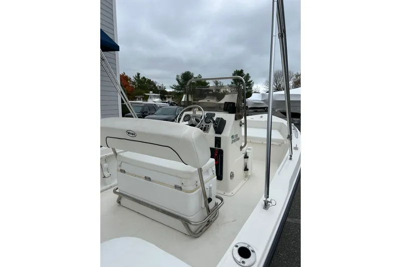 Slide: The Image of 2014 Key West 1720 Center Console boat with steering wheel and control panel. - 9