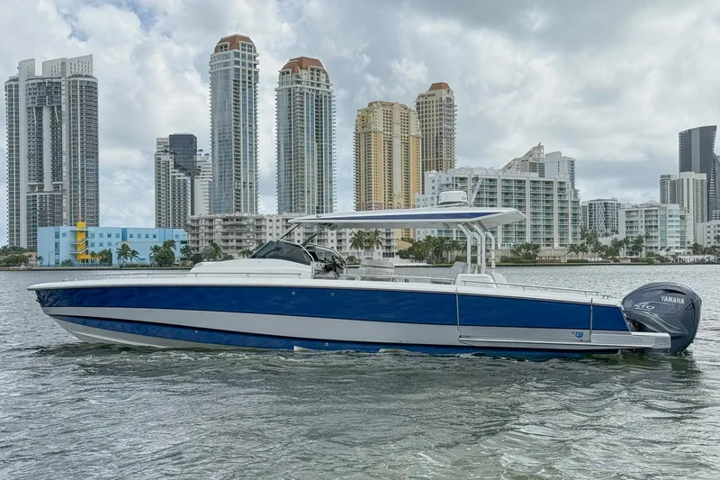 Slide: The Image of 2024 Opus OPUS 12 boat on water with city skyline background. - 0