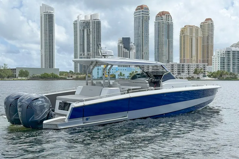 Slide: The Image of 2024 Opus OPUS 12 boat on water with city skyline background. - 1