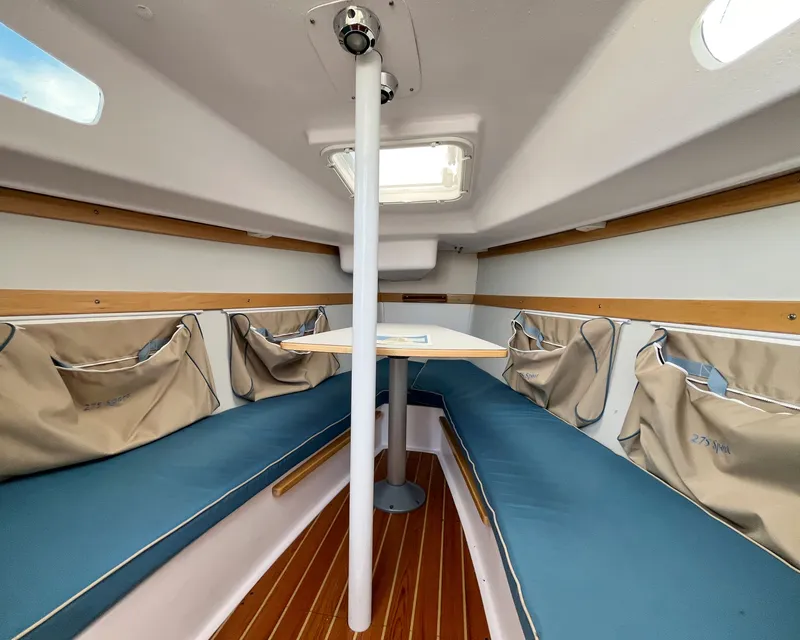 Slide: The Image of Interior of 2021 Catalina 275 Sport with blue seating cushions. - 21