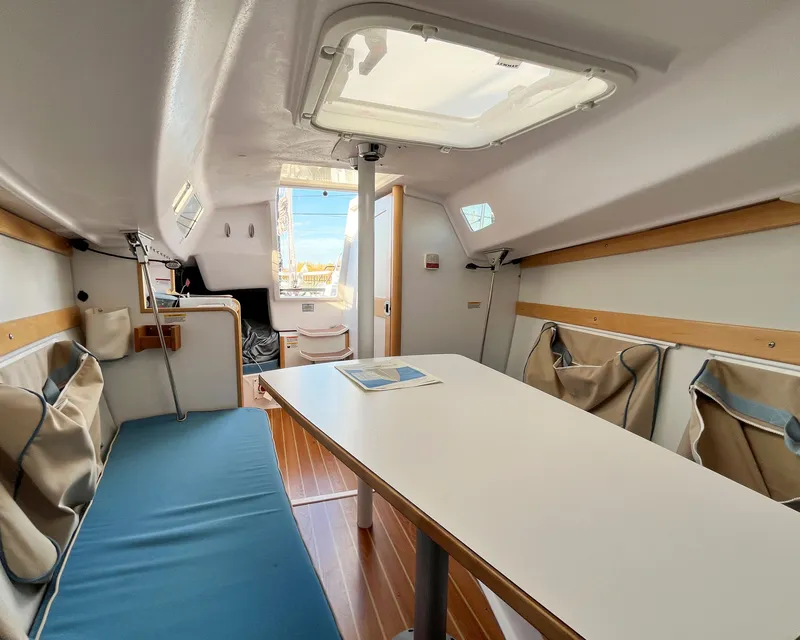 Slide: The Image of Interior of 2021 Catalina 275 Sport with table and seating area. - 22