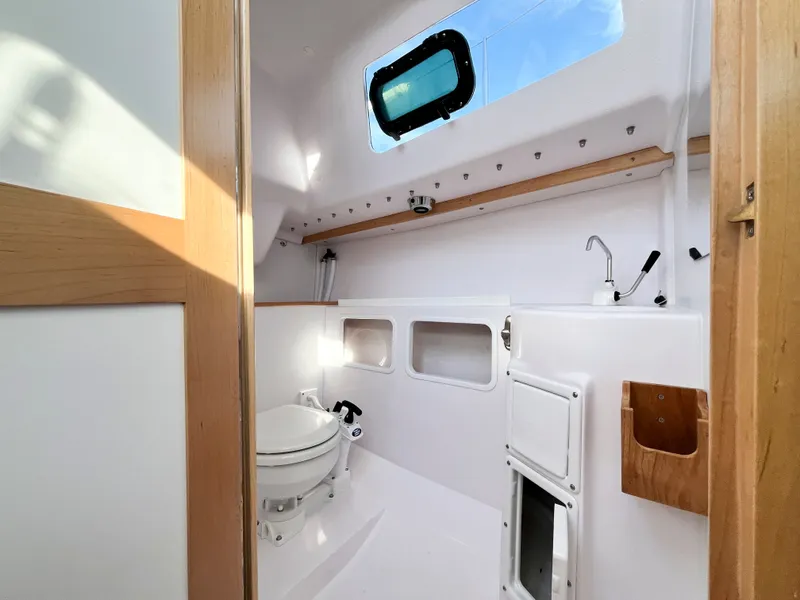 Slide: The Image of Interior of 2021 Catalina 275 Sport featuring toilet and sink. - 24