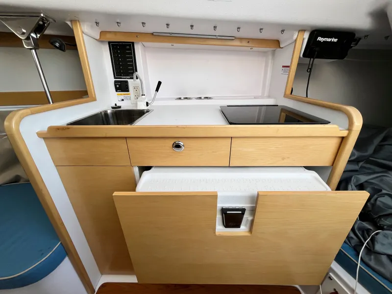Slide: The Image of Interior of 2021 Catalina 275 Sport featuring modern kitchenette. - 26
