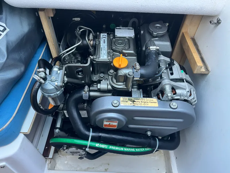 Slide: The Image of Engine compartment of 2021 Catalina 275 Sport with visible engine. - 28