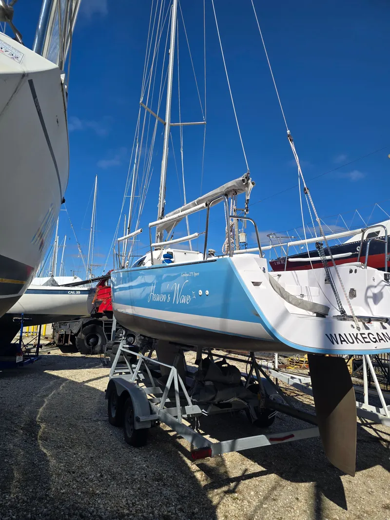Slide: The Image of 2021 Catalina 275 Sport sailboat on trailer outdoors. - 8