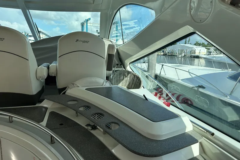 Slide: The Image of Interior of 2011 Cruisers Yachts 540 Sports Coupe, featuring sleek seating and modern design. - 19