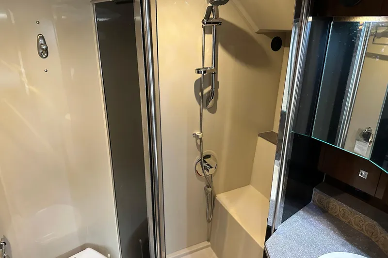 Slide: The Image of Luxurious bathroom in 2011 Cruisers Yachts 540 Sports Coupe with modern shower and sleek design. - 31