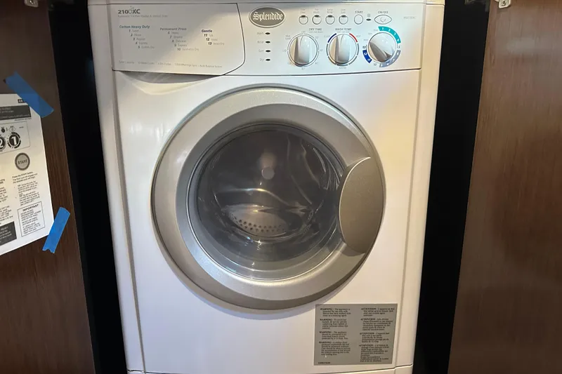 Slide: The Image of Splendide 2100XC washer-dryer in 2011 Cruisers Yachts 540 Sports Coupe. - 32