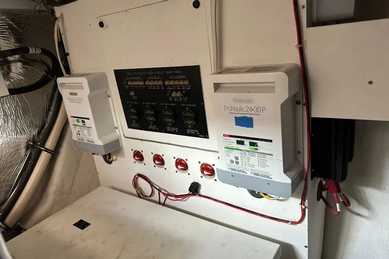 Slide: The Image of Electrical panel and chargers in 2011 Cruisers Yachts 540 Sports Coupe engine room. - 41