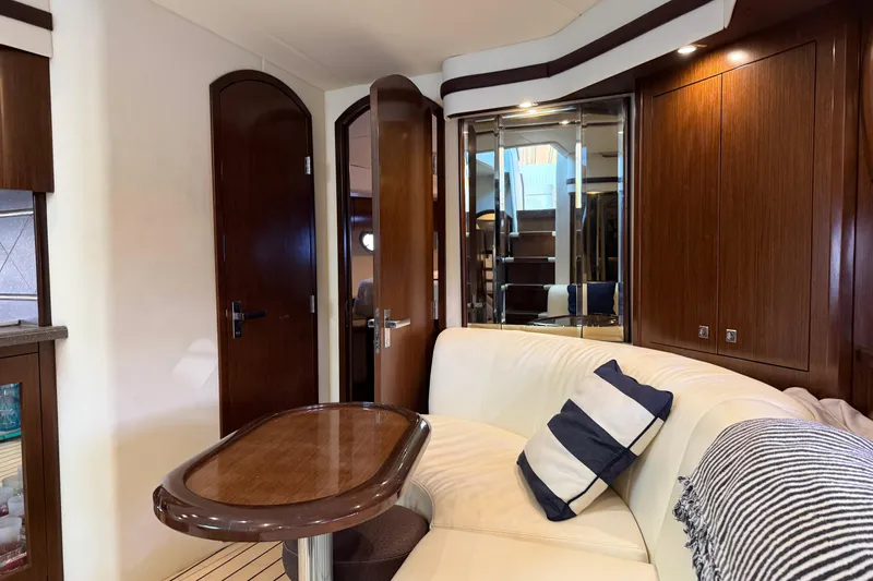Slide: The Image of Luxurious interior of 2011 Cruisers Yachts 540 Sports Coupe with elegant wood finishes. - 49