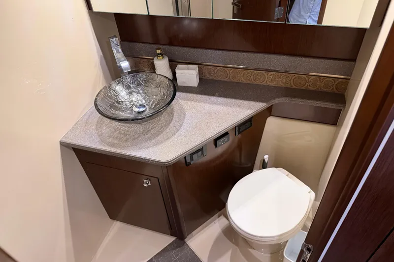 Slide: The Image of Luxurious bathroom in 2011 Cruisers Yachts 540 Sports Coupe with modern glass sink. - 53