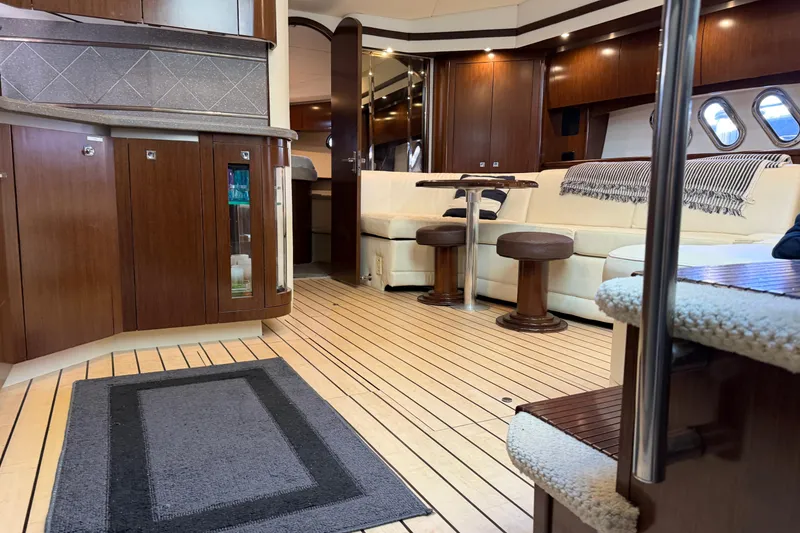 Slide: The Image of Luxurious interior of 2011 Cruisers Yachts 540 Sports Coupe with elegant wood finishes. - 57