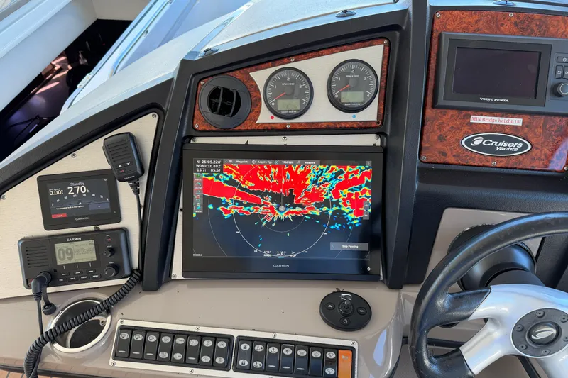 Slide: The Image of Dashboard of 2011 Cruisers Yachts 540 Sports Coupe with navigation and control systems. - 64