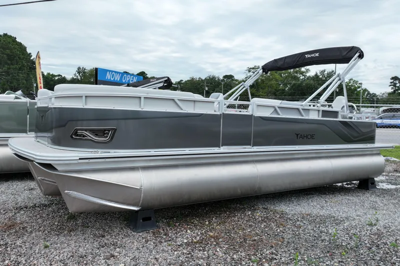 The Image of 2026 Tahoe Pontoon Sport 85 Rear Fish boat displayed outdoors on gravel. - 0