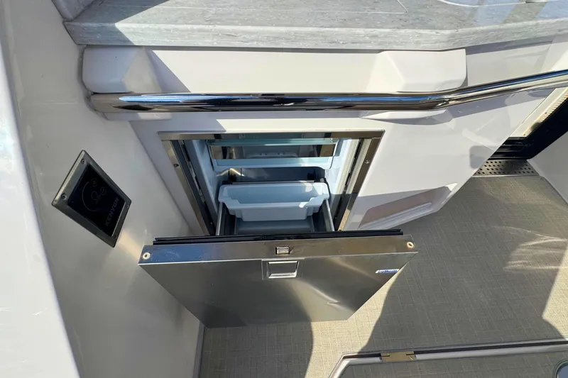 Slide: The Image of Interior of 2021 Regal 38 Grande Coupe with beige seating and wood accents. - 16