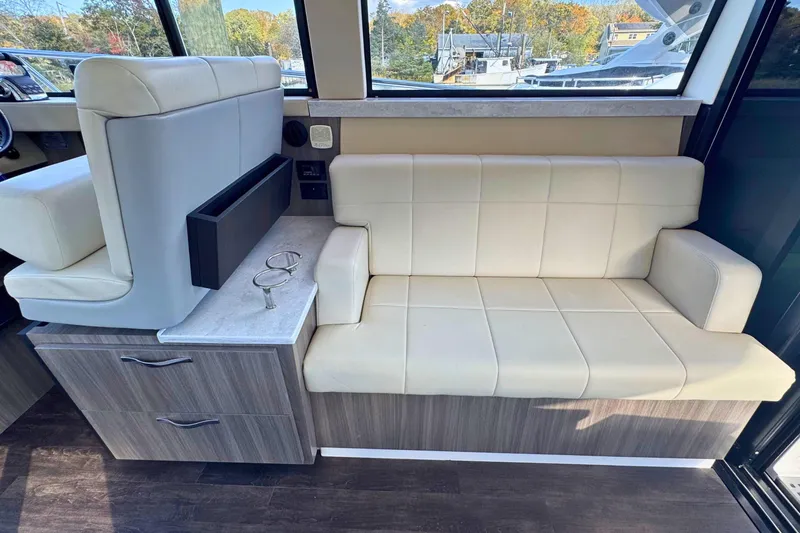 Slide: The Image of Modern kitchen area in 2021 Regal 38 Grande Coupe yacht with sleek countertops. - 17