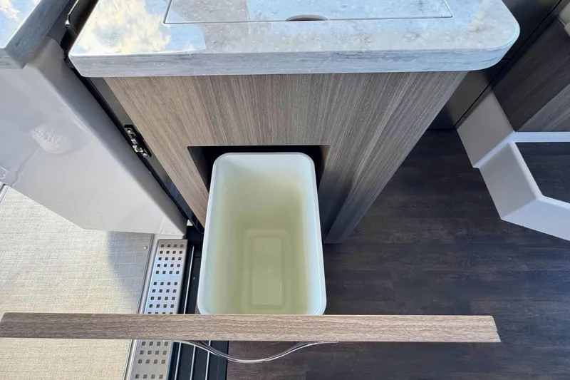 Slide: The Image of Modern kitchen area in 2021 Regal 38 Grande Coupe with sink and Kenyon cooktop. - 19