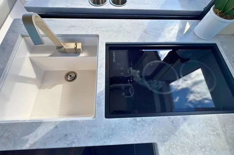 Slide: The Image of Stainless steel drawers in 2021 Regal 38 Grande Coupe interior, featuring modern design and wood accents. - 20