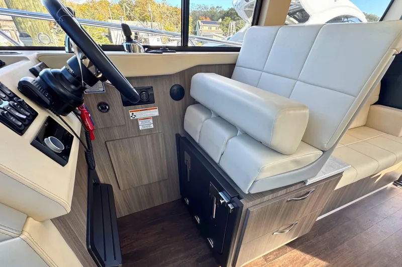 Slide: The Image of Interior of 2021 Regal 38 Grande Coupe with modern helm and seating area. - 26