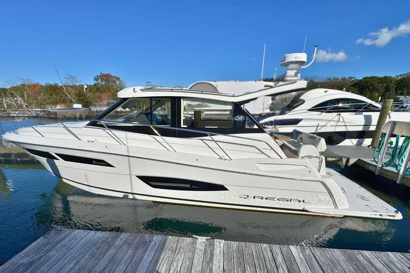 Slide: The Image of 2021 Regal 38 Grande Coupe docked in a marina, Providence, RI. - 3