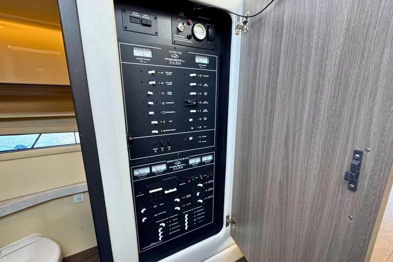 Slide: The Image of Luxurious bathroom in 2021 Regal 38 Grande Coupe yacht with modern fixtures and porthole view. - 31