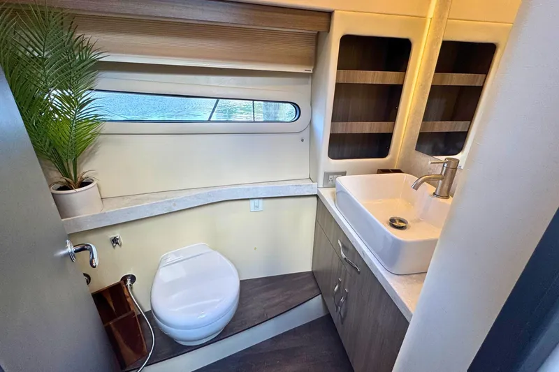 Slide: The Image of Luxurious bedroom interior of 2021 Regal 38 Grande Coupe yacht with elegant bedding. - 32