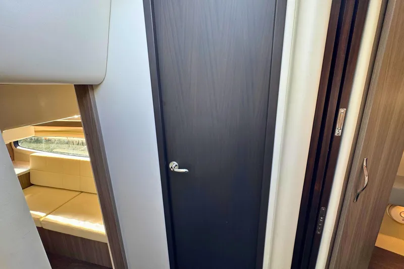 Slide: The Image of Luxurious interior of 2021 Regal 38 Grande Coupe with cozy bedding and ocean view. - 34